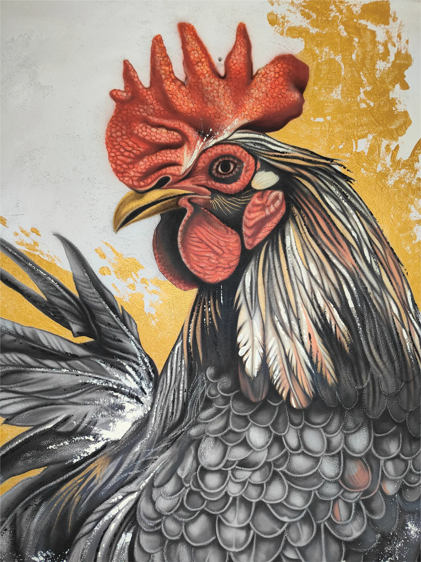 Red comb and detailed face of the rooster in the Gallo Nero mural.