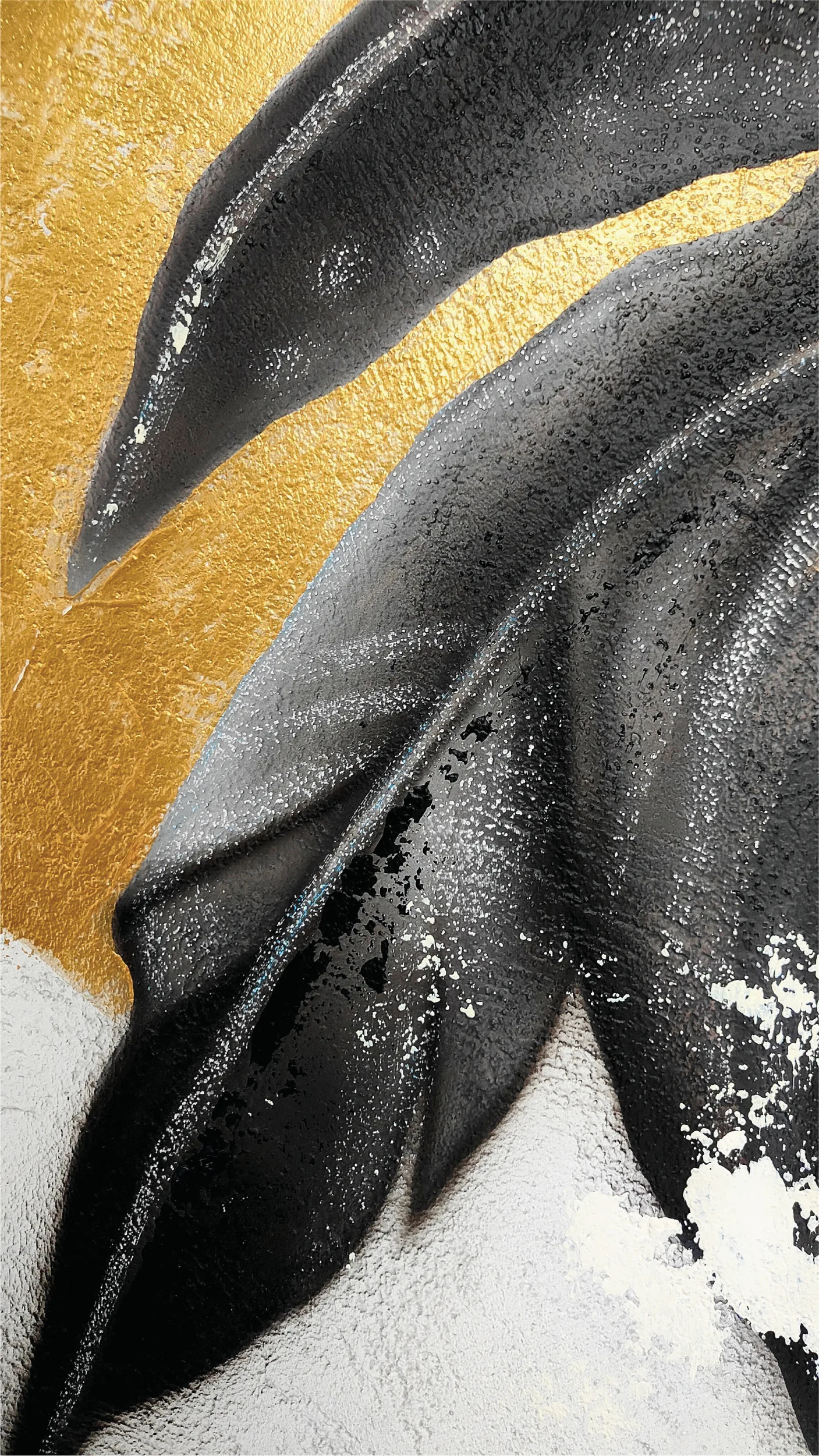 Long black feather detail against a gold background.