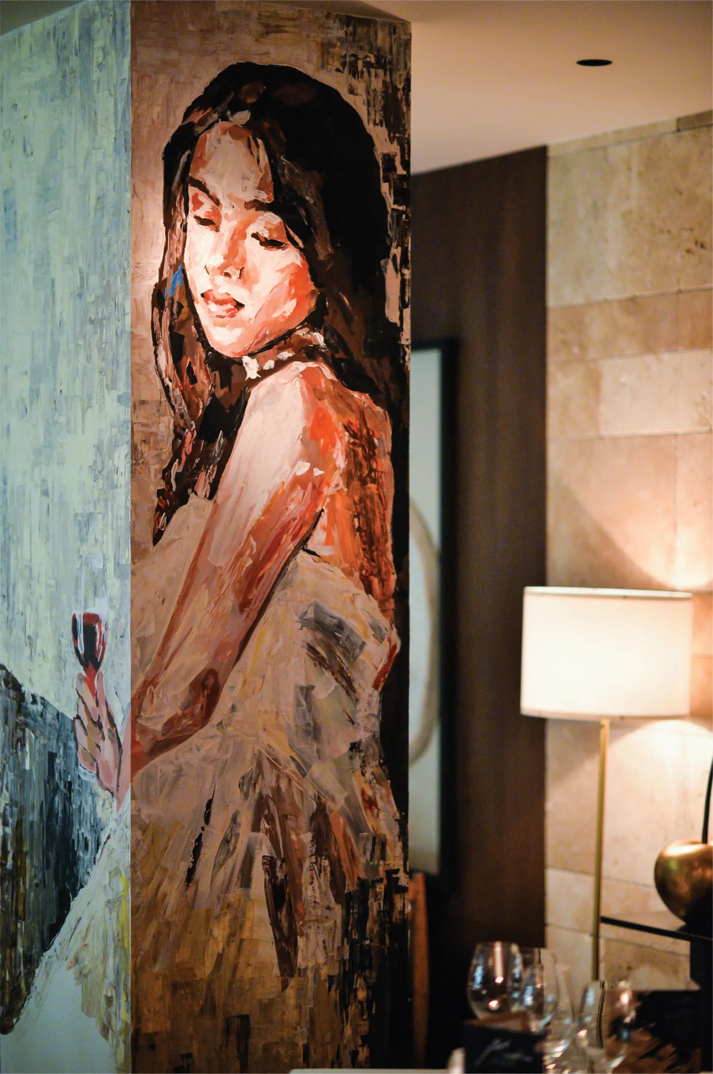 Painted portrait on a pillar at Mudra Cuisine.